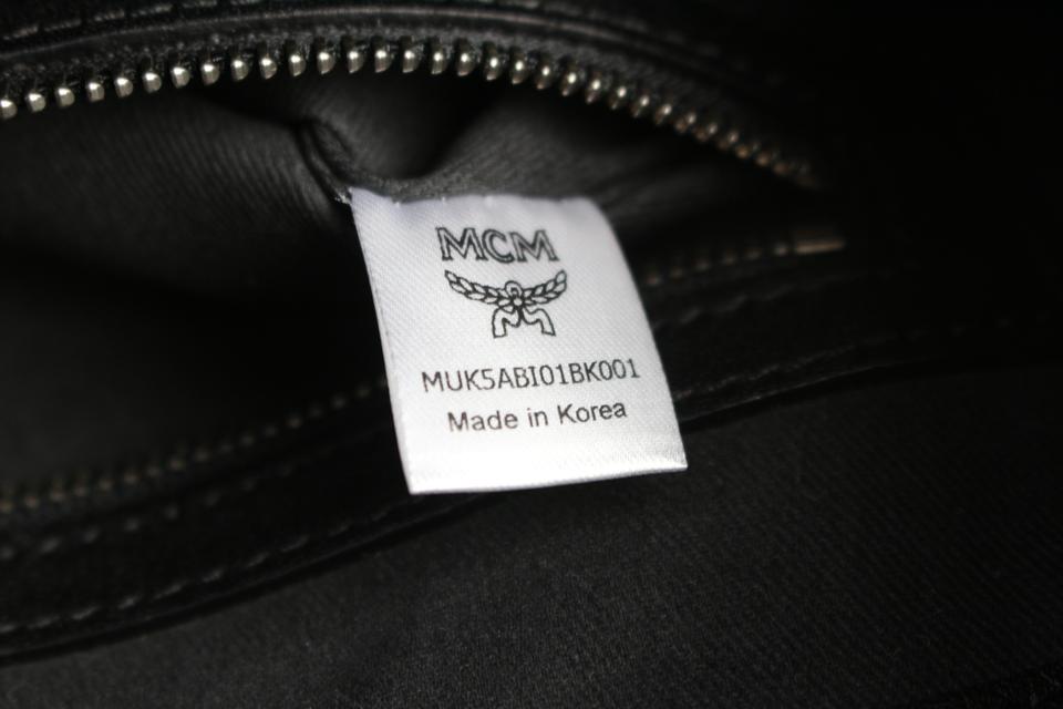 MCM Black Leather Embossed Logo Front Pocket Zip Bag — Labels Resale  Boutique