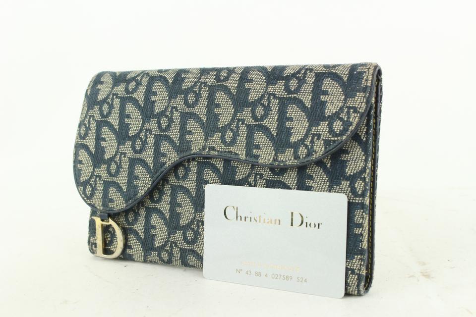 Christian Dior a brown canvas clutch and wallet  Bukowskis