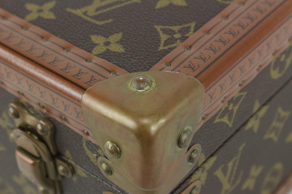 Louis Vuitton, A Louis Vuitton initial monogrammed vanity case with brass  metal mounts and brown leather trims