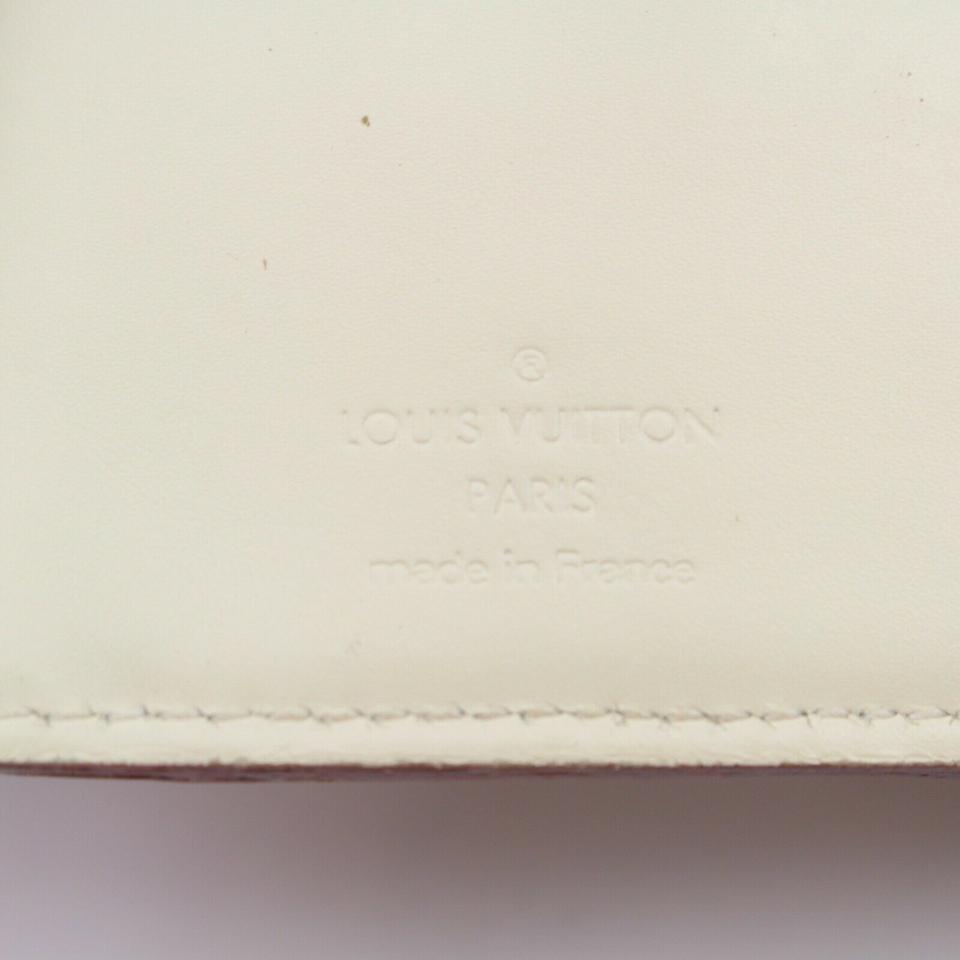 Lot 56 - Louis Vuitton Ivory Suhali Compact Zip Wallet