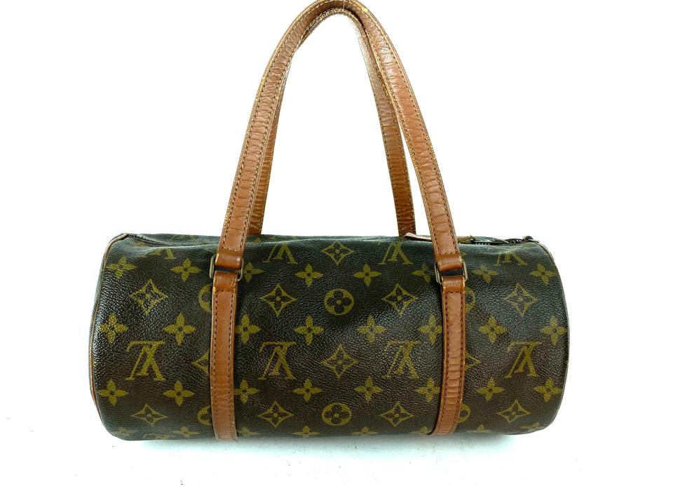 Louis Vuitton cylinder shaped monogrammed bag photographed on a