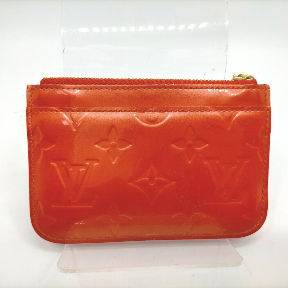 Clutch bag Louis Vuitton Orange in Other - 24736278